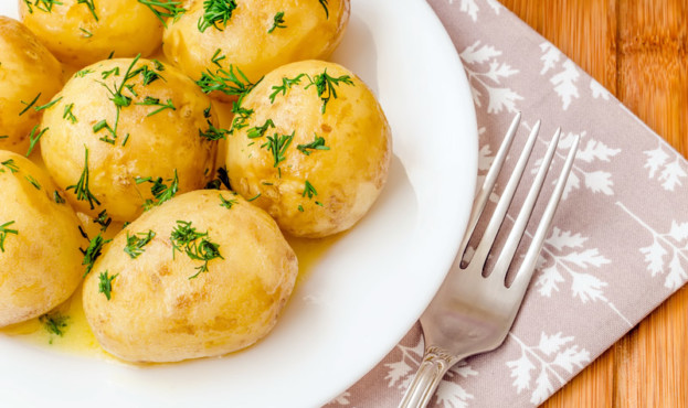 Traditional Ukrainian food boiled new potatoes with butter and dill