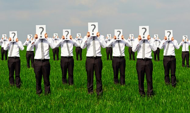crowd of businessmen with question mark